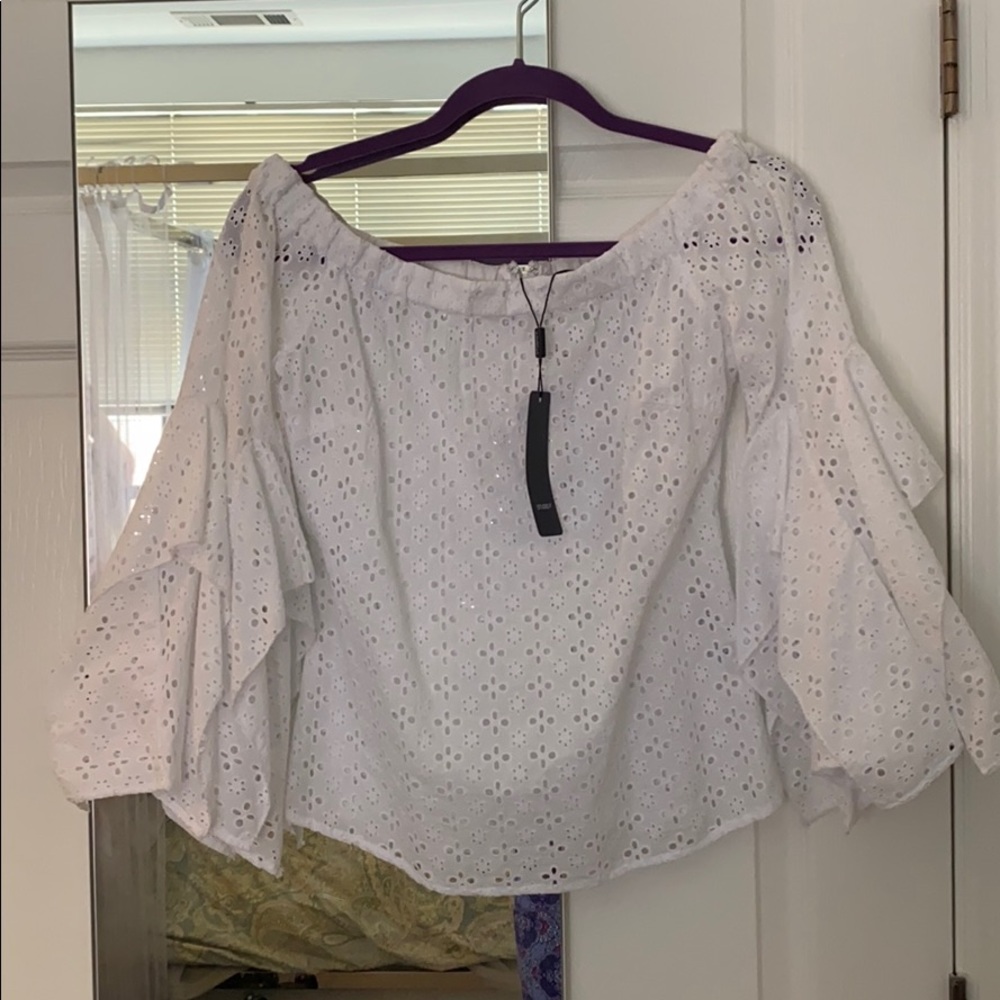 White eyelet pattern with bell sleeves